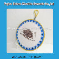 Colorful design ceramic hot pot mat with blue rope